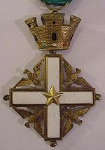 A white Greek cross embellished in the four principal angles with gold eagles displayed and surmounted by a gold crown of four towers.