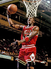 Michael Jordan preparing to dunk the basketball