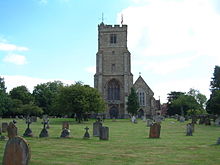 Stone church surrounded by graves