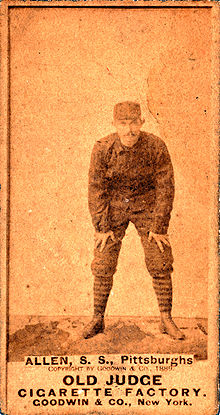 Sepia-tone baseball card of Bob Allen bent over, by the Old Judge Cigarette Factory