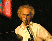 David Gates speaks into the microphone at Bowery Poetry Club in New York City.