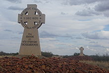 Photograph of two memorial crosses on stone mounds