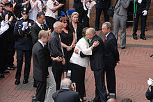 Timoshenko's mother, Tatyana, receiving the Medal of Honor for her son. Present are NYPD Commissioner Raymond Kelly and New York City Mayor Michael Bloomberg
