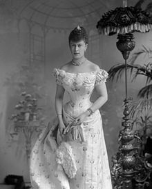 Young lady in a tightly-corseted dress