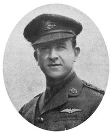 Portrait of man in military uniform with peaked cap