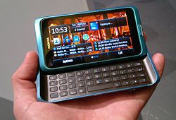 Nokia E7 with homescreen.jpg
