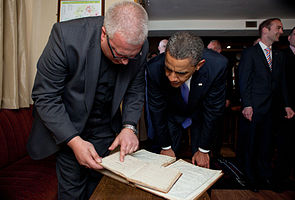 Stephen Neill shows the President his ancestral records