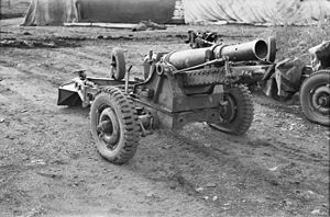 An artillery gun mounted on a wheeled gun carriage
