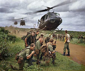 Australian soldiers from 7 RAR waiting to be picked up by US Army helicopters following a cordon and search operation near Phước Hải in 1967