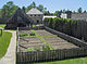 View of a vegetable garden, buildings and stockades at the reconstructed Sainte-Marie Among the Hurons Mission