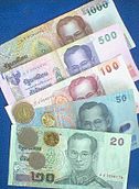 Baht banknotes and coins