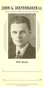 Election poster naming Diefenbaker and with his photograph, with blank spaces for the time and place at which he would speak. His hair is still short and dark, and is combed back, and his face appears much the way it will in later years. He wears a jacket and tie.