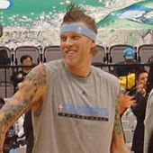 Chris Andersen, a Caucasian male with spiked brown hair, is smiling.