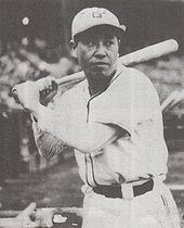 Black and white photograph showing Haruyasu Nakajima with a bat over his shoulder preparing to bat.