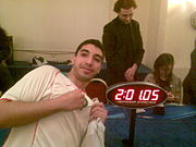 Monir Amerkhous shows his happiness after setting a new national record in Rubik's Cube.