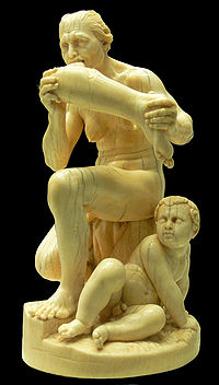 Marble statue of naked woman eating a human leg with a child watching at her feet