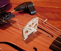 Piezoelectric violin bridge pickup