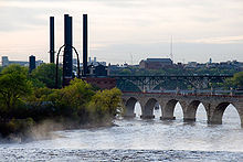 photo of the Mississippi with several bridges and the steam plant