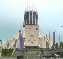 A view from the front the wigwam-shaped cathedral showing steps leading up to the entrance.