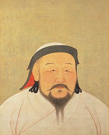 Yellowed painting of the head and shoulders of a plump middle-aged Asian man.  He is wearing a white robe and a white cap with black trim.  He has a long black moustache and a forked beard.