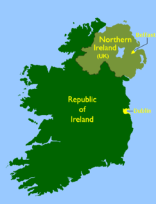 a map showing the outline of Ireland in the colour green with the capitals of the North and South marked on it