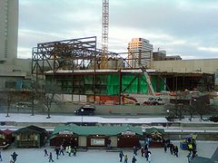 Steel skeleton of building being erected within construction site