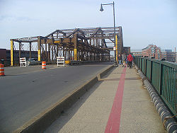 The Charlestown Bridge, looking north. The red line on the pavement is the Freedom Trail marking