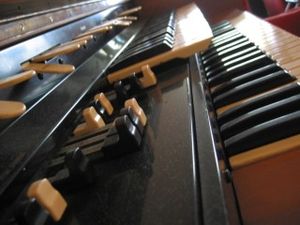 A close-up of the Hammond L-100 organ, with the drawbars in the foreground