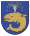 A coat of arms depicting a sea creature with sharp teeth, one protruding bottom tooth, and a blowhole spewing water