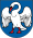 A coat of arms depicting a white bird with wings outspread, a red beak, and red feet all on a dark blue background