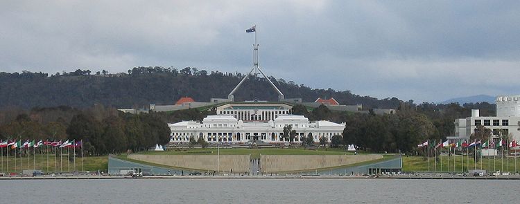 Lake Burley Griffin in the foreground, Commonwealth Place and Old Parliament House in the middle, and Parliament House in the background